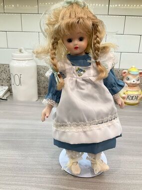 VINTAGE REGENCY‎ FINE ARTS PORCELAIN DOLL WITH BLUE DRESS  AND PINAFORE 13in.